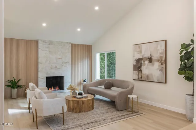 a living room with furniture and a fireplace