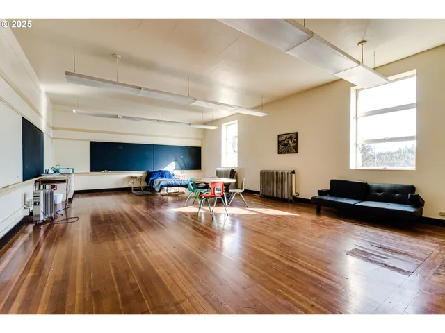 a view of a livingroom with wooden floor
