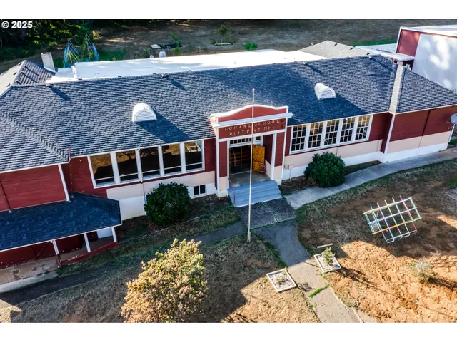 a aerial view of a house with a yard