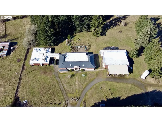a aerial view of a house with a big yard