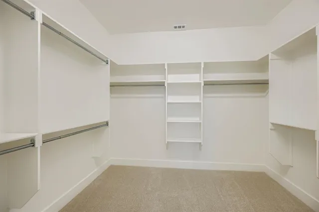 a view of an empty walk in closet
