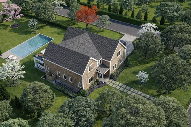 an aerial view of a house with a yard