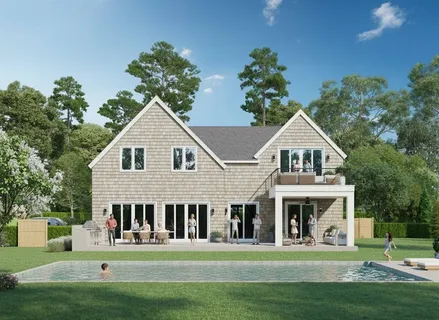 a front view of a residential houses with yard and green space