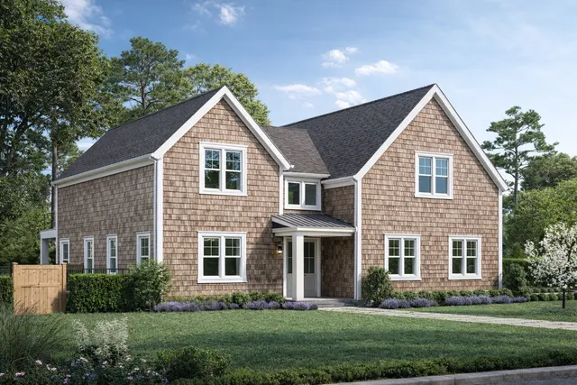 a view of house with yard and green space