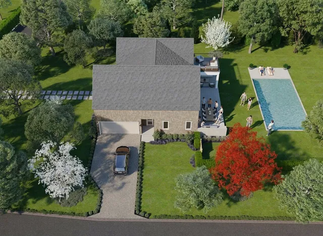 an aerial view of a house with a garden and yard