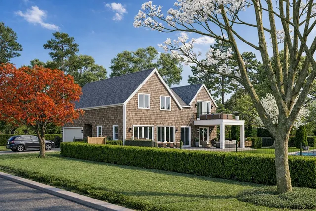 a front view of a house with a garden