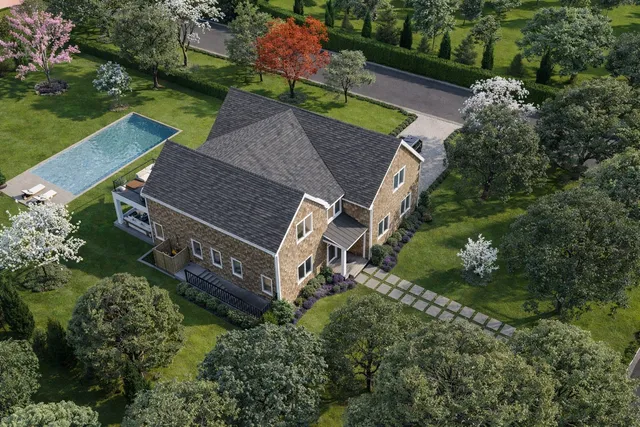 an aerial view of a house with a yard