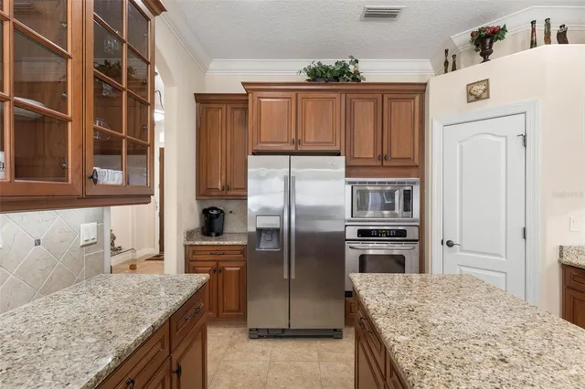 a bathroom with a granite countertop sink and a bathtub