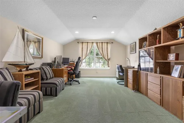 a room with furniture and pool table
