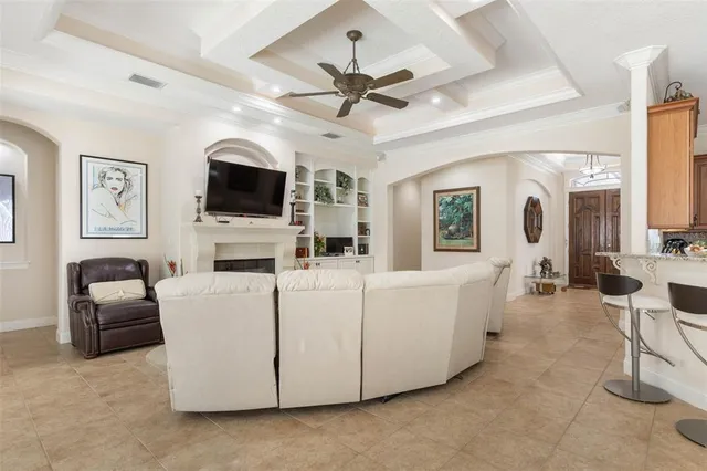 a view of a dining room with furniture and chandelier