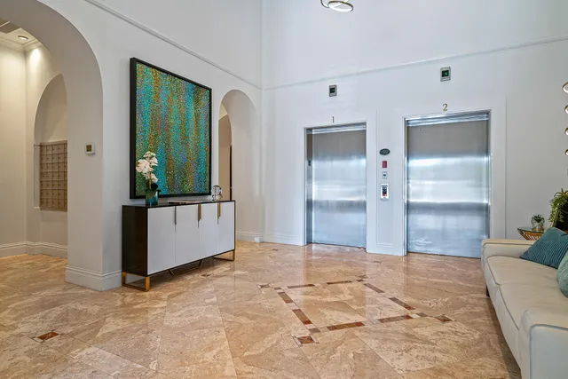 a view of a bathroom with a tub shower and mirror