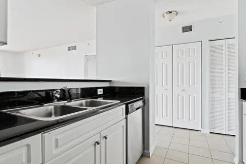a kitchen with a sink and cabinets
