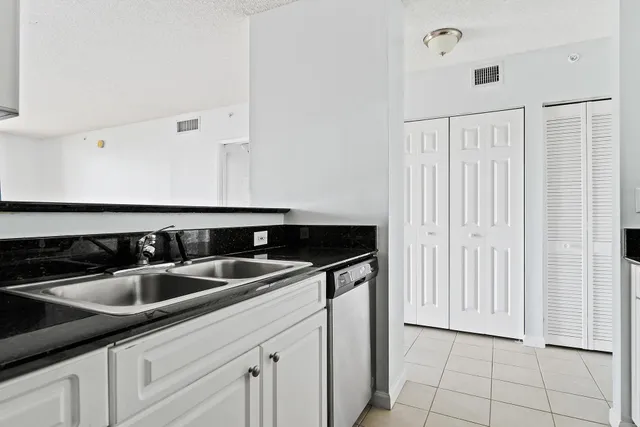 a kitchen with a sink and cabinets