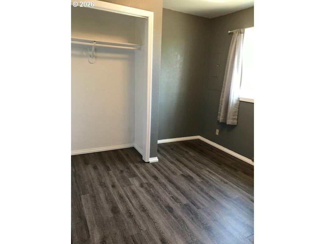 302 West 3rd Street Wallowa, OR 97885 - Photo 6 of 10 a view of room with wooden floor