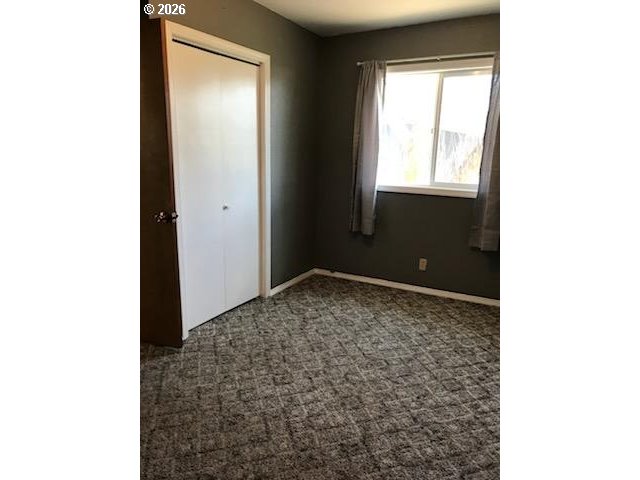 302 West 3rd Street Wallowa, OR 97885 - Photo 8 of 10 a room with a window