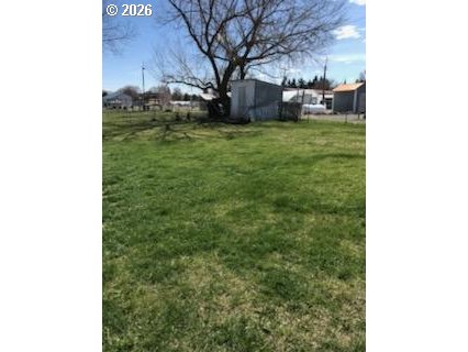 302 West 3rd Street Wallowa, OR 97885 - Photo 10 of 10 a backyard of a house with table and chairs