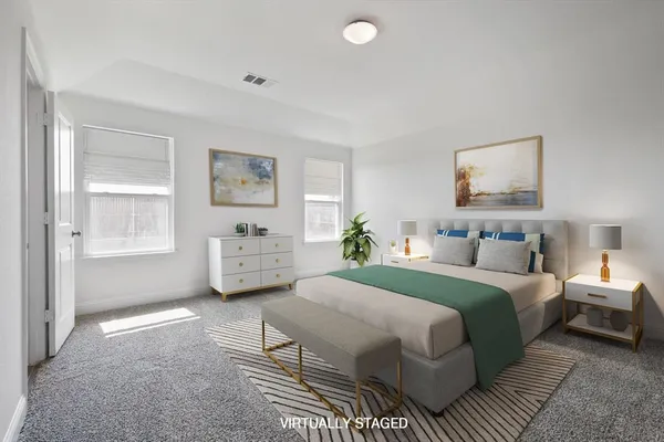 a bedroom with a bed large window and wall painting