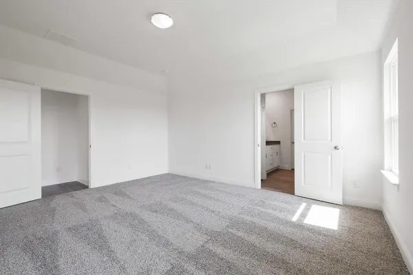 a view of an empty room and window