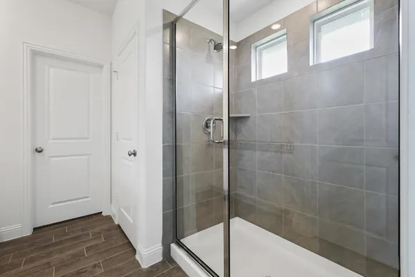 a bathroom with a bathtub and a shower