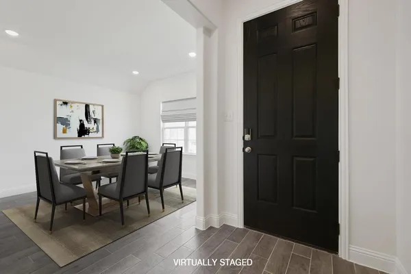 a view of a dining room with furniture and window