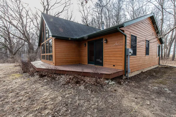 a view of balcony with wooden floor and fence