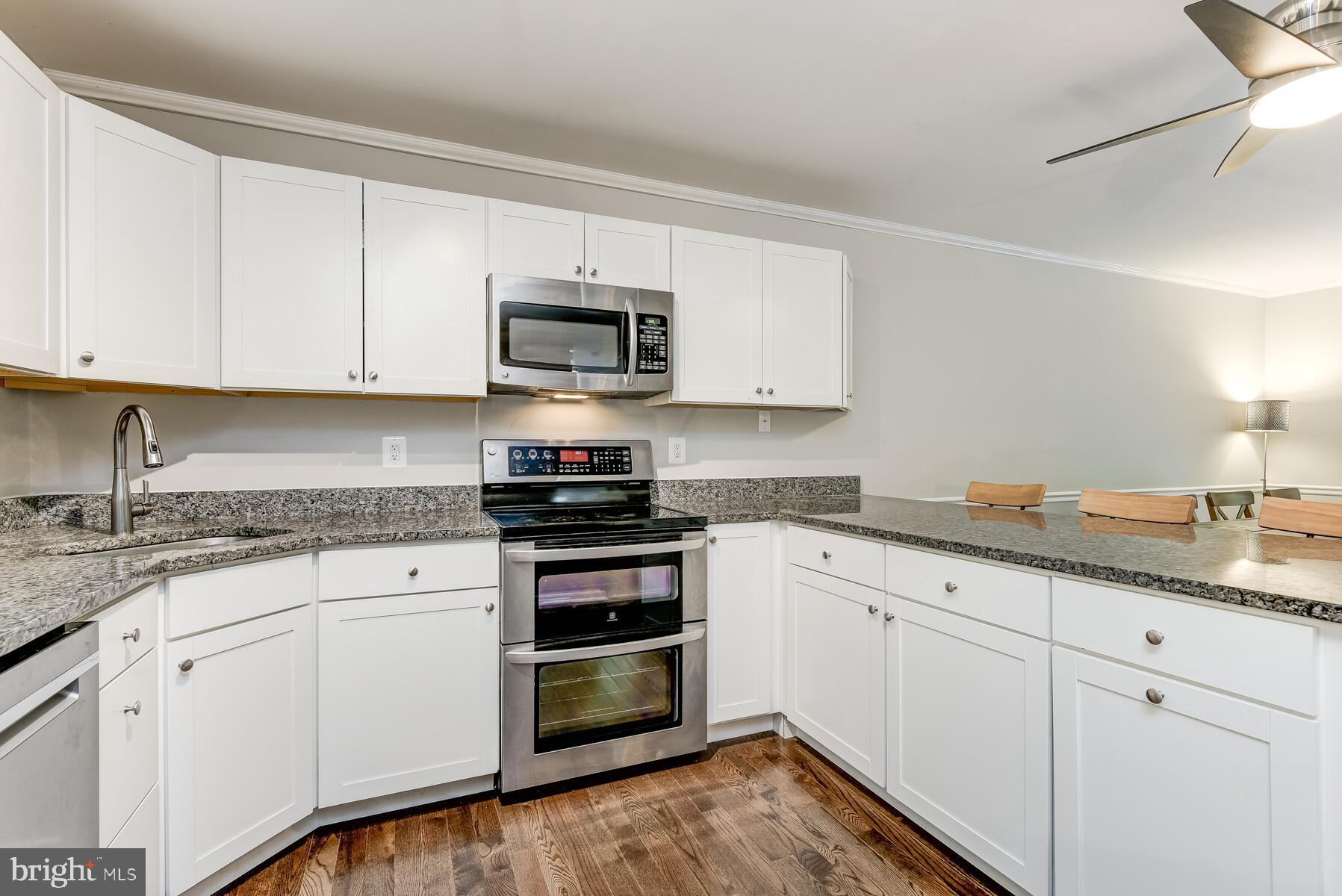 925 Diggs Road Crownsville, MD 21032 - Photo 5 of 40 White cabinetry with stainless steel appliances