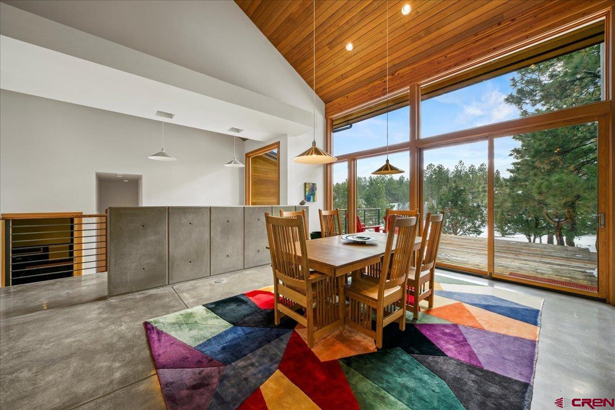 412 South Badger Trail Ridgway, CO 81432 - Photo 11 of 45 a dining room with furniture and a floor to ceiling window