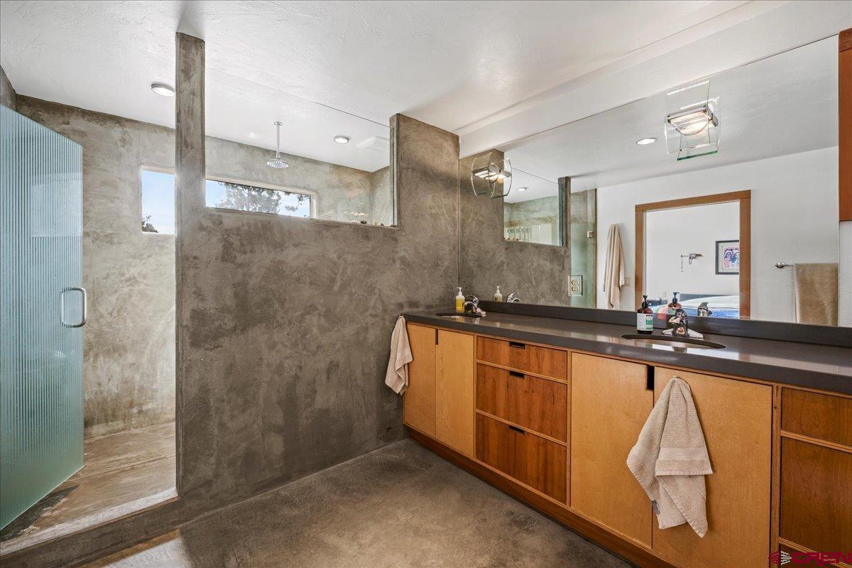 412 South Badger Trail Ridgway, CO 81432 - Photo 15 of 45 a bathroom with double vanity and a bathtub