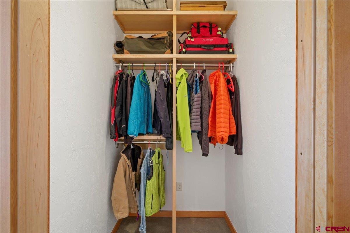 412 South Badger Trail Ridgway, CO 81432 - Photo 22 of 45 a view of walk in closet with clothes and shoes