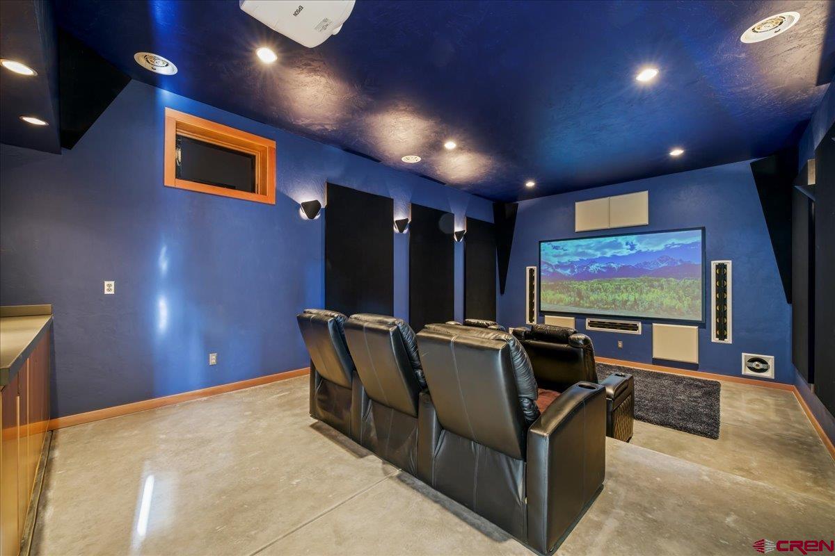 412 South Badger Trail Ridgway, CO 81432 - Photo 27 of 45 a living room with furniture and projector screen