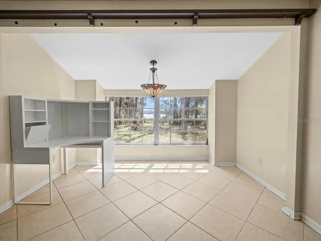 a view of kitchen with furniture and a window