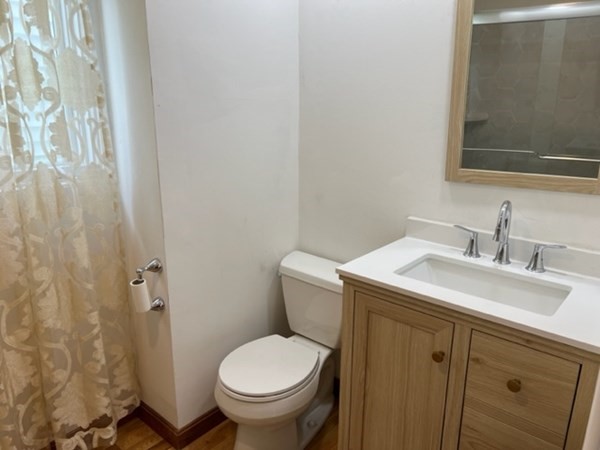 142 Shaw Street Lowell, MA 01851 - Photo 13 of 31 a bathroom with a sink and toilet