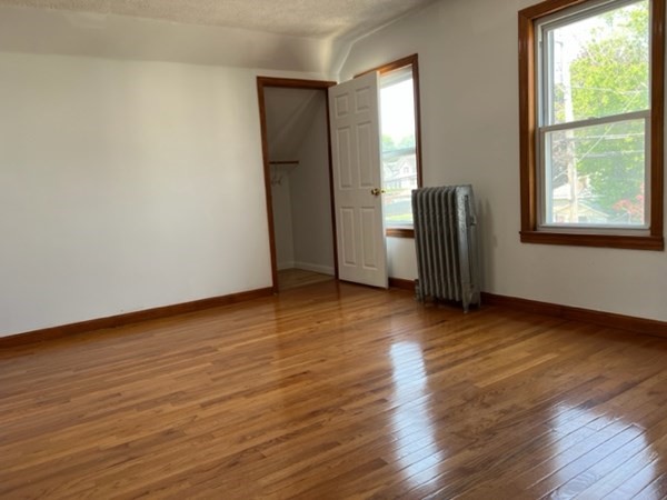142 Shaw Street Lowell, MA 01851 - Photo 20 of 31 a view of a room with wooden floor and window