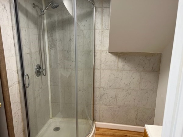 142 Shaw Street Lowell, MA 01851 - Photo 22 of 31 a bathroom with a shower and toilet