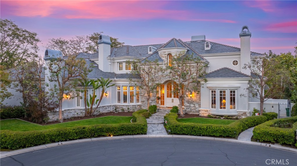 2 Shetland Coto de Caza, CA 92679 - Photo 2 of 6 front view of house with a yard and potted plants
