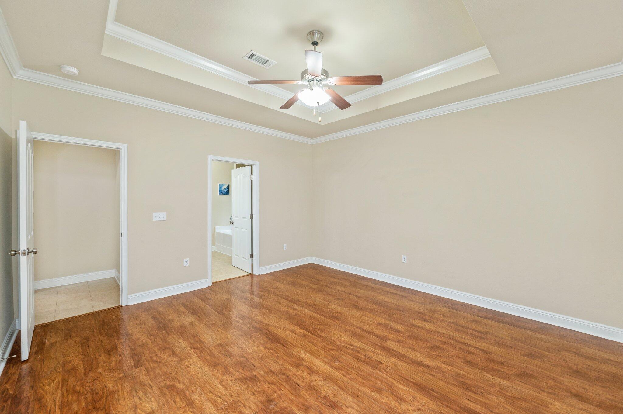 615 Red Fern Road Crestview, FL 32536 - Photo 21 of 33 a view of an empty room with wooden floor