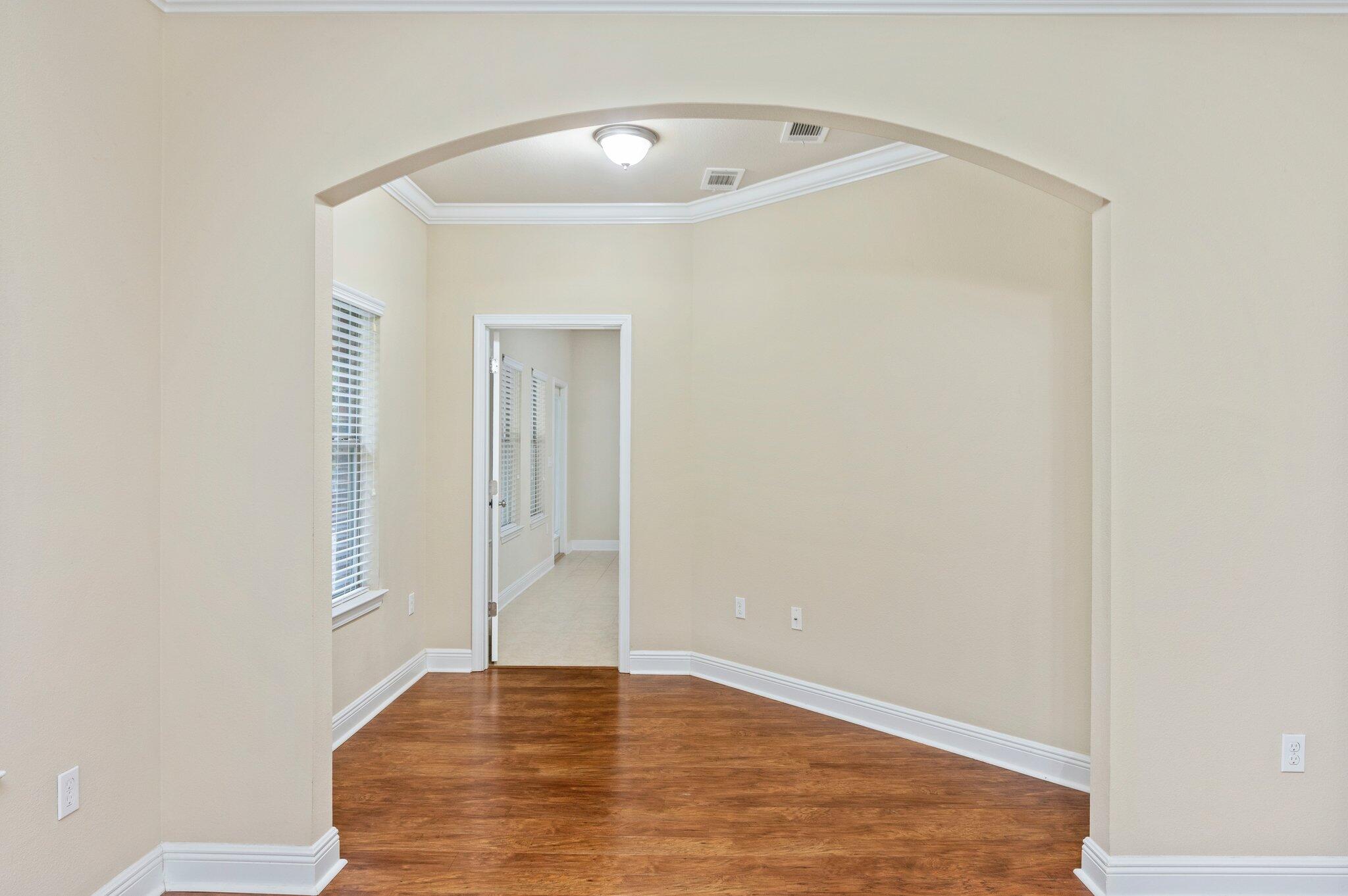 615 Red Fern Road Crestview, FL 32536 - Photo 22 of 33 a view of an empty room with closet and wooden floor