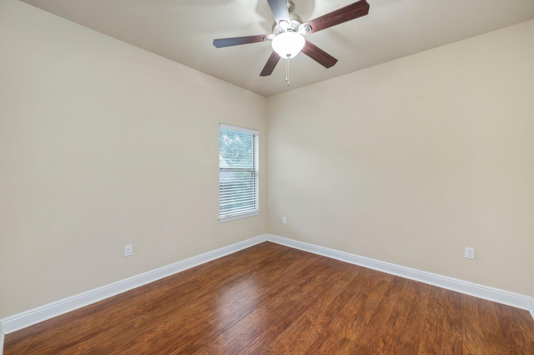 615 Red Fern Road Crestview, FL 32536 - Photo 27 of 33 wooden floor in an empty room with a window