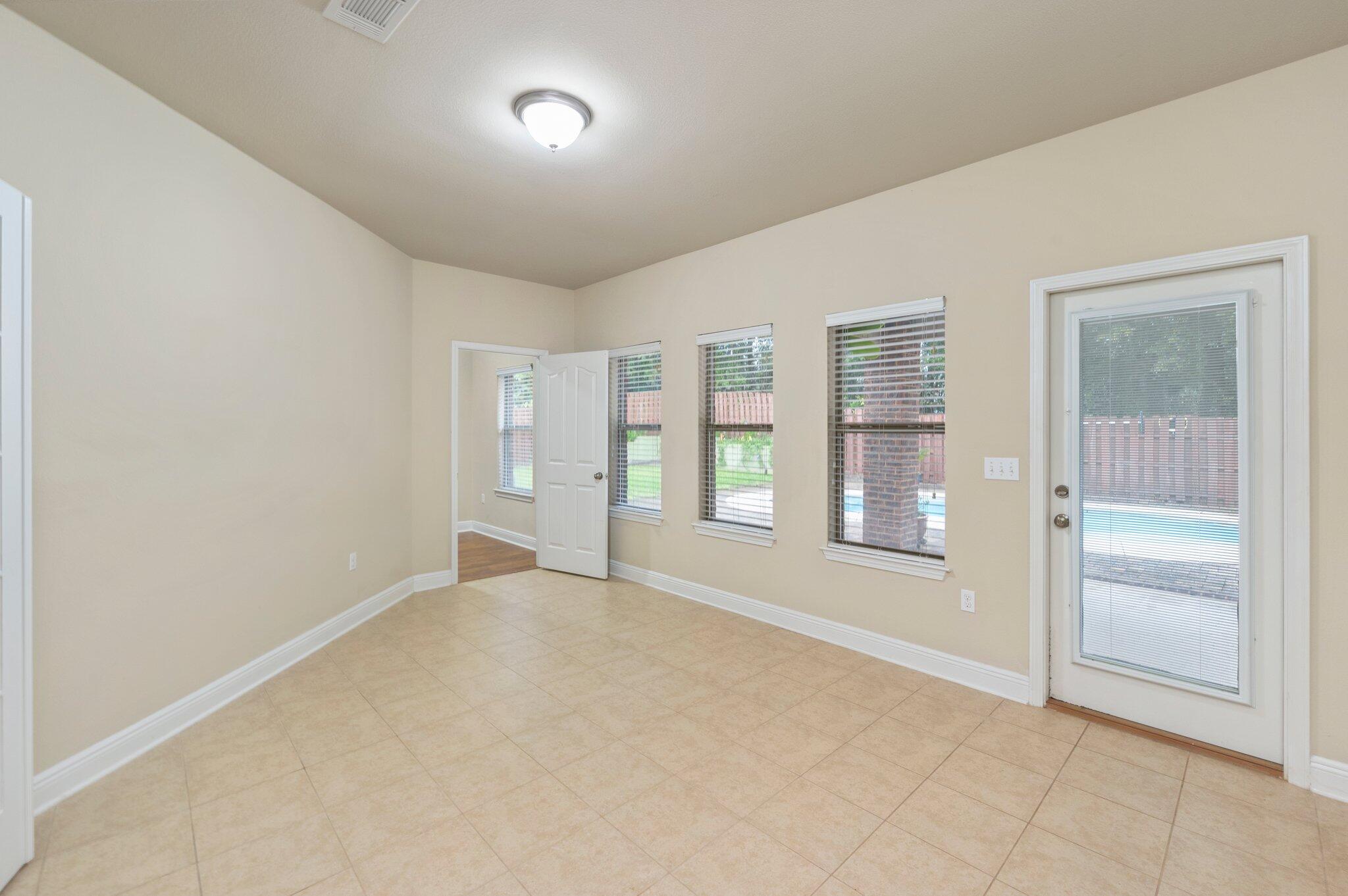 615 Red Fern Road Crestview, FL 32536 - Photo 28 of 33 wooden floor in an empty room with a window