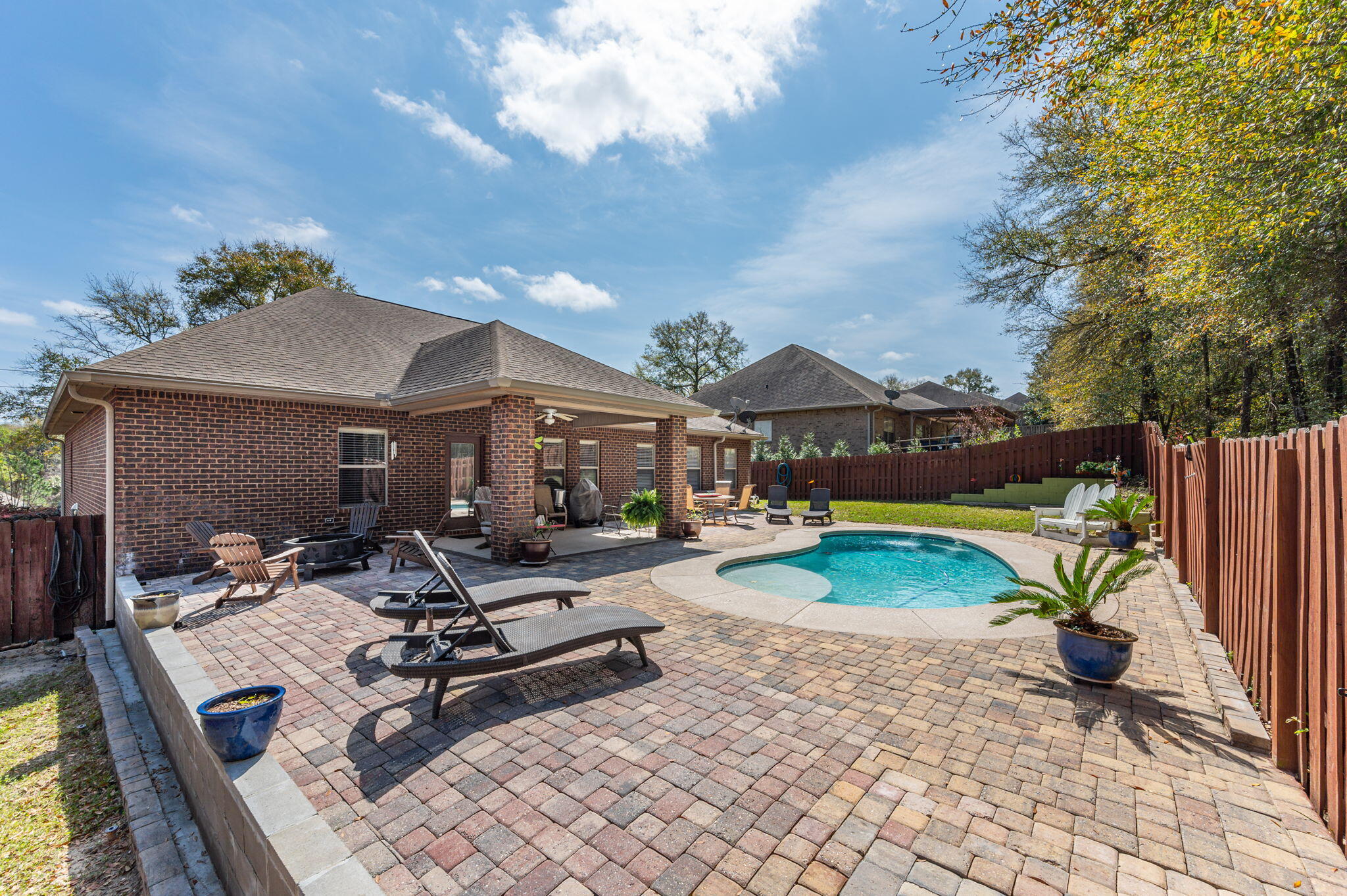 615 Red Fern Road Crestview, FL 32536 - Photo 31 of 33 a view of a house with swimming pool and sitting area