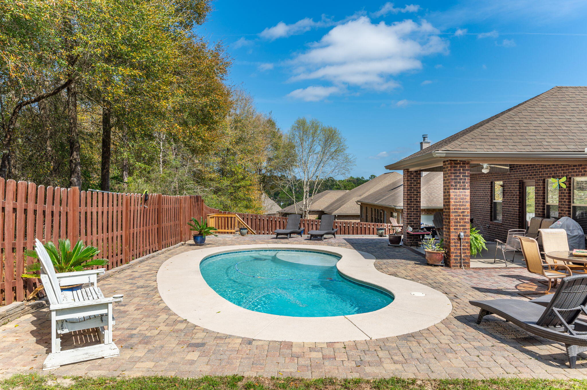 615 Red Fern Road Crestview, FL 32536 - Photo 32 of 33 a view of a backyard with plants and patio