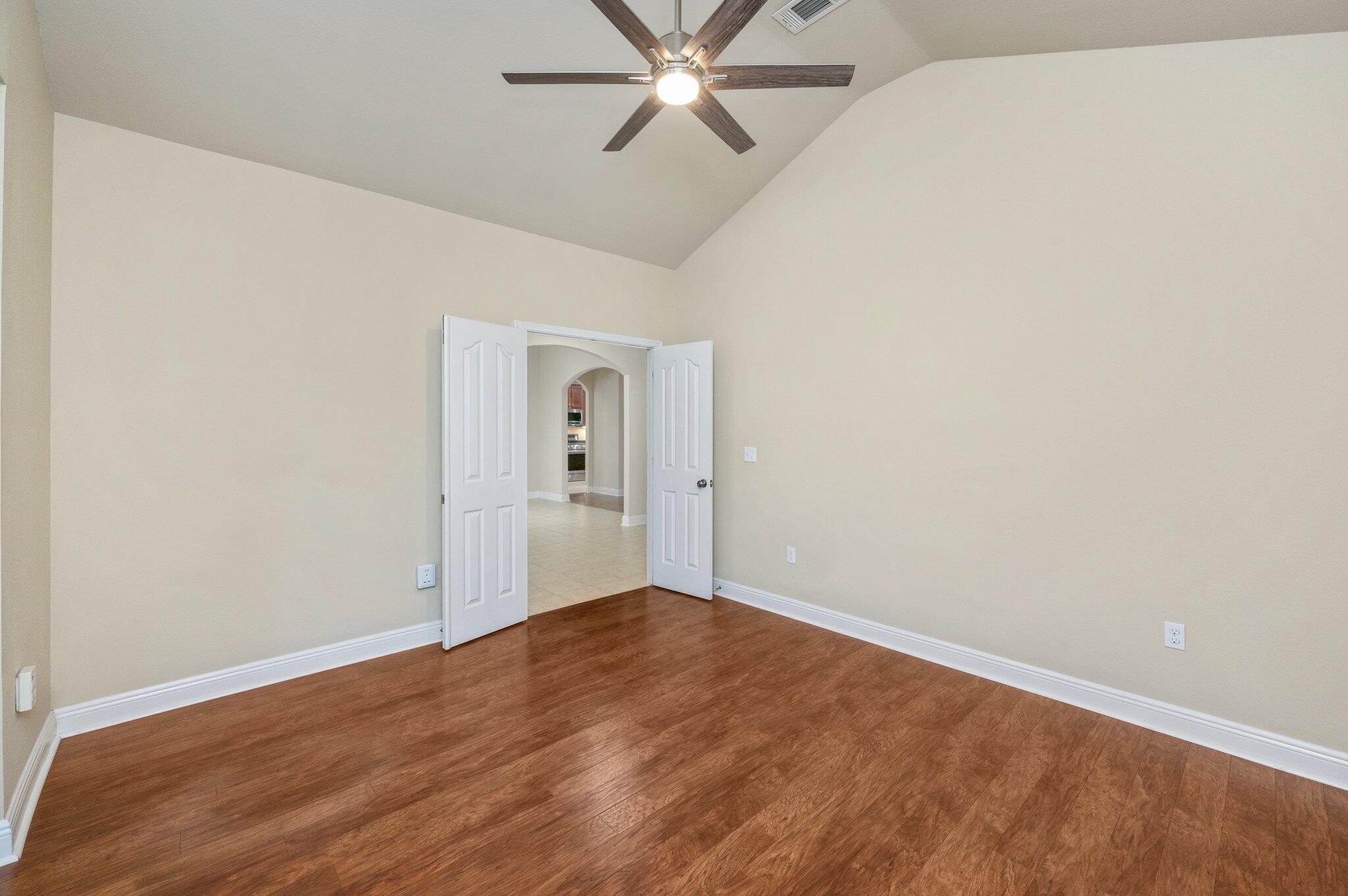 615 Red Fern Road Crestview, FL 32536 - Photo 8 of 33 an empty room with a ceiling fan and window