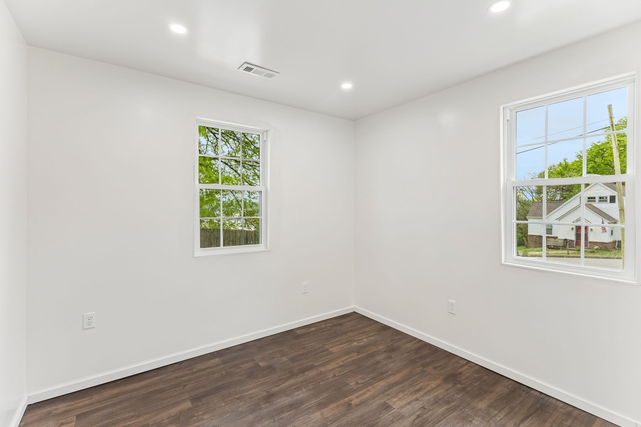 330 West Washington Street Pulaski, TN 38478 - Photo 29 of 36 an empty room with wooden floor and windows