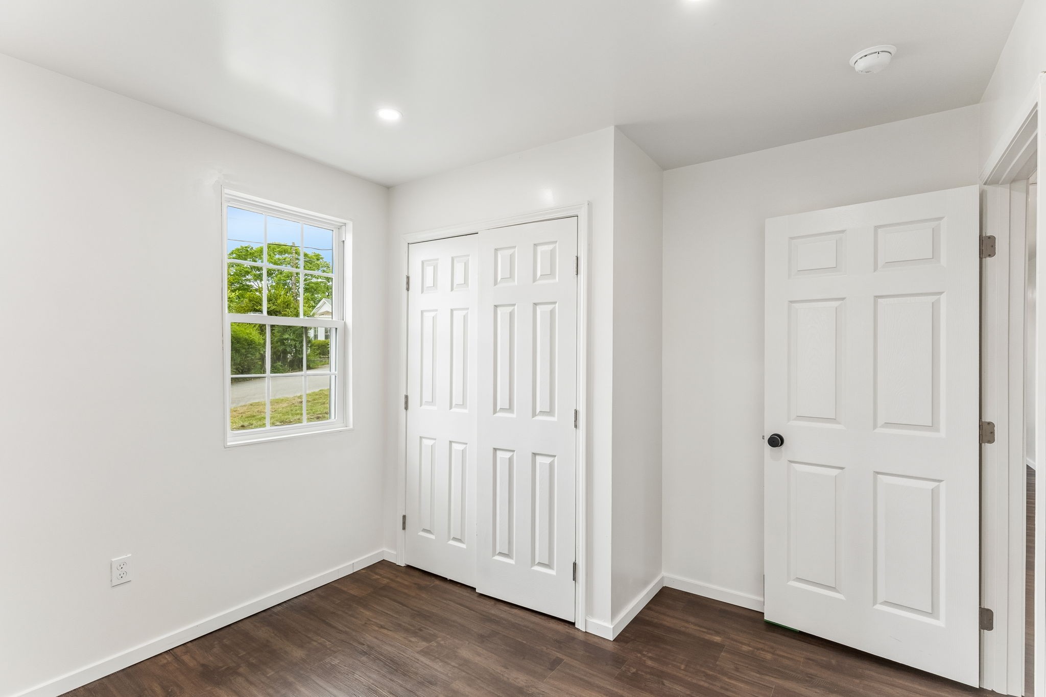 330 West Washington Street Pulaski, TN 38478 - Photo 30 of 36 an empty room with wooden floor and windows