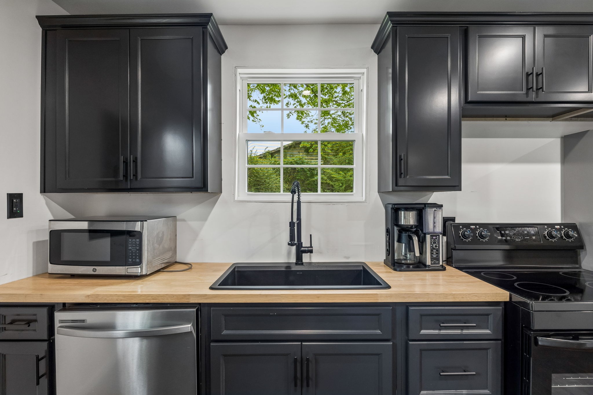 330 West Washington Street Pulaski, TN 38478 - Photo 8 of 36 a kitchen with a stove and a microwave