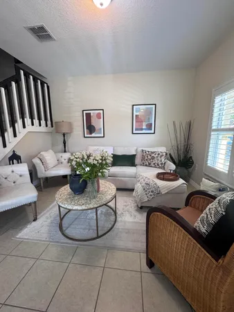 a living room with furniture and window