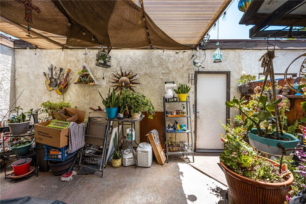 7381 Katella Avenue Stanton, CA 90680 - Photo 8 of 21 patio leading to two car garage
