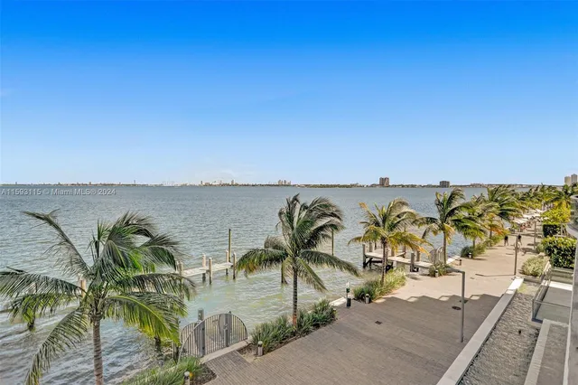 a view of a swimming pool with outdoor seating