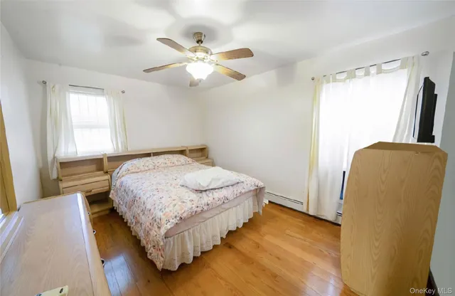 a bedroom with bed and window