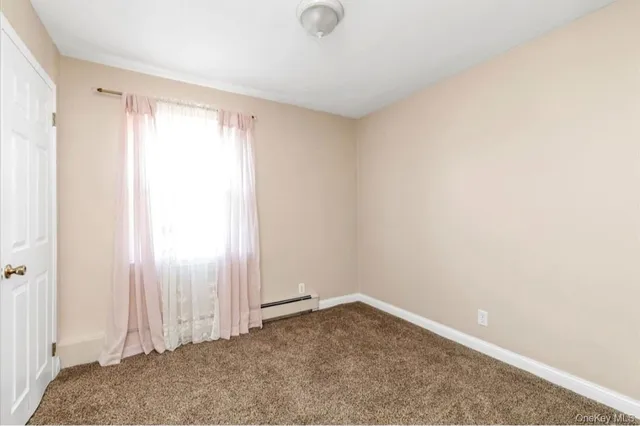 a view of a room that has a window in it